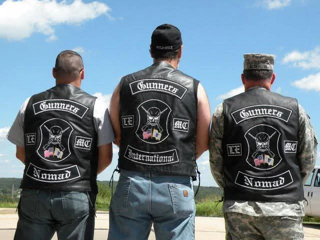 Three members of Gunners Law Enforcement MC wearing their back patches, embroidered by Independence Embroidery in Owensville, Missouri.