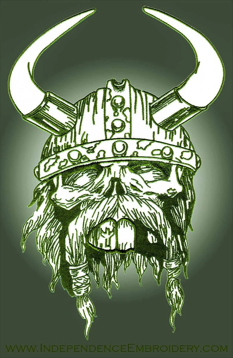 An embroidered patch of a horned Viking head in green thread, made by Independence Embroidery in Owensville, Missouri.
