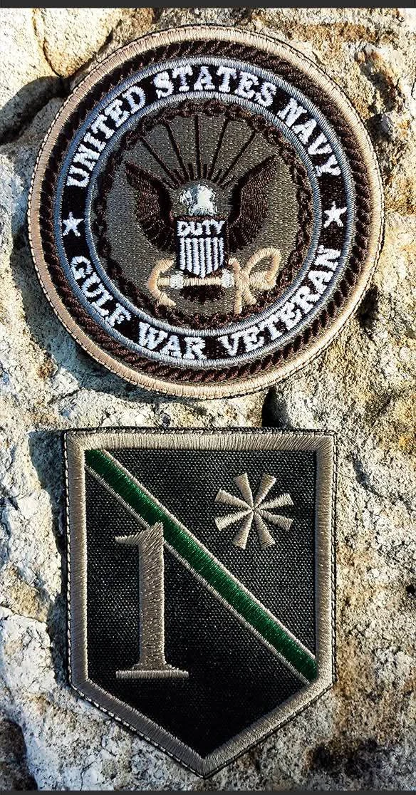 Veteran unit patches and tabs on a vest, embroidered by Independence Embroidery in Owensville, Missouri.