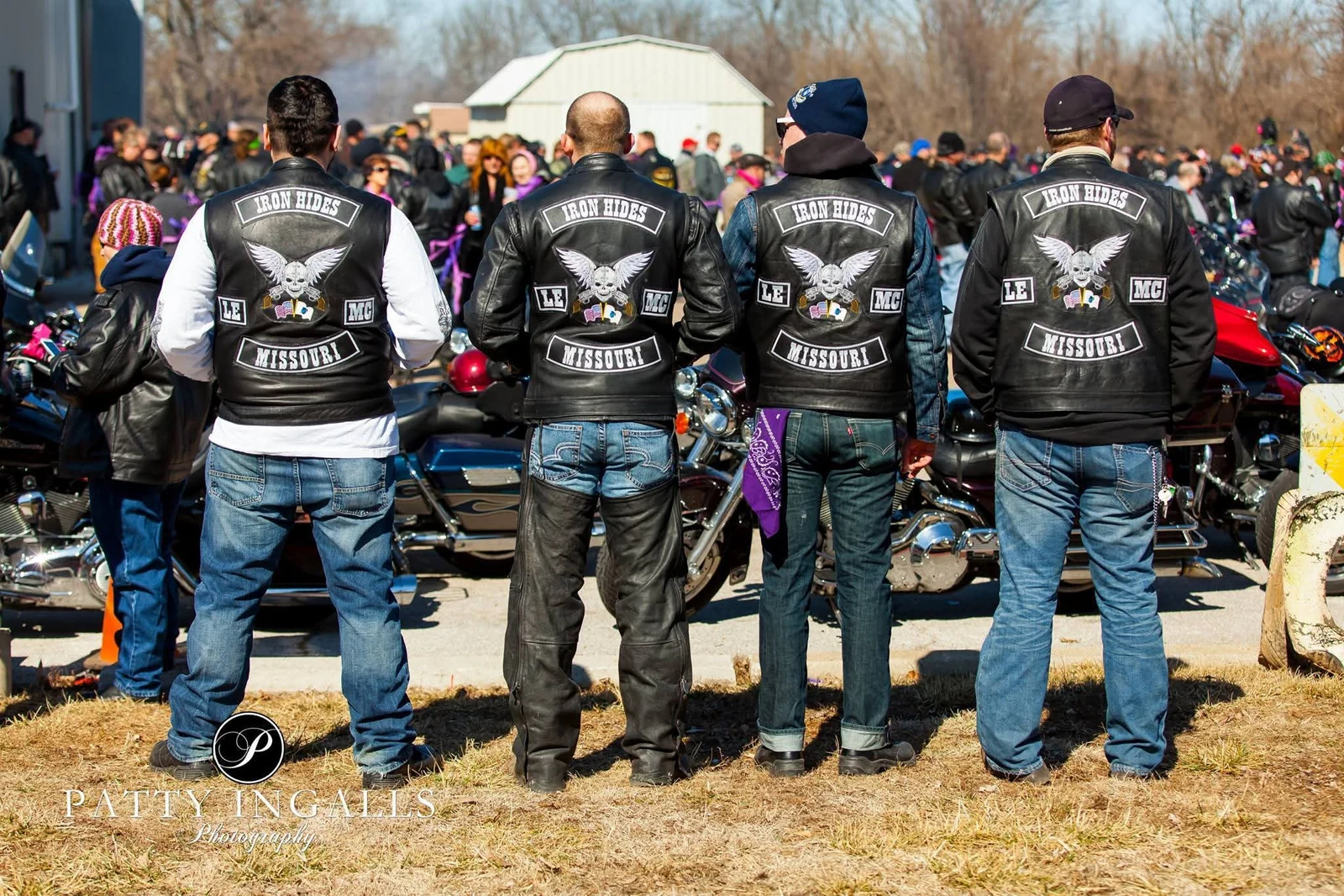 Four club members wearing full sets of back patches, embroidered by Independence Embroidery in Owensville, Missouri.