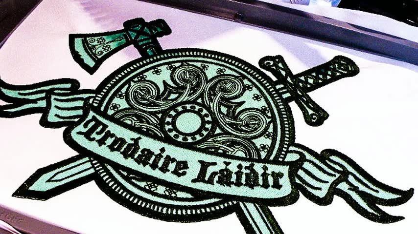 Silent loop of a patch being stitched, from outline to finished piece.